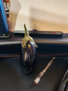 Eggplant left on Kelly's Desk