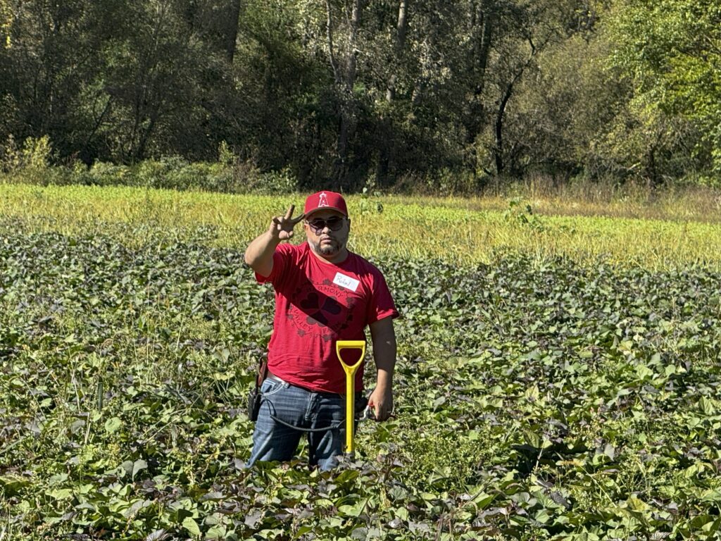 2025-0928 Rafael getting ready to dig sweet potatoes at the Harvest Party