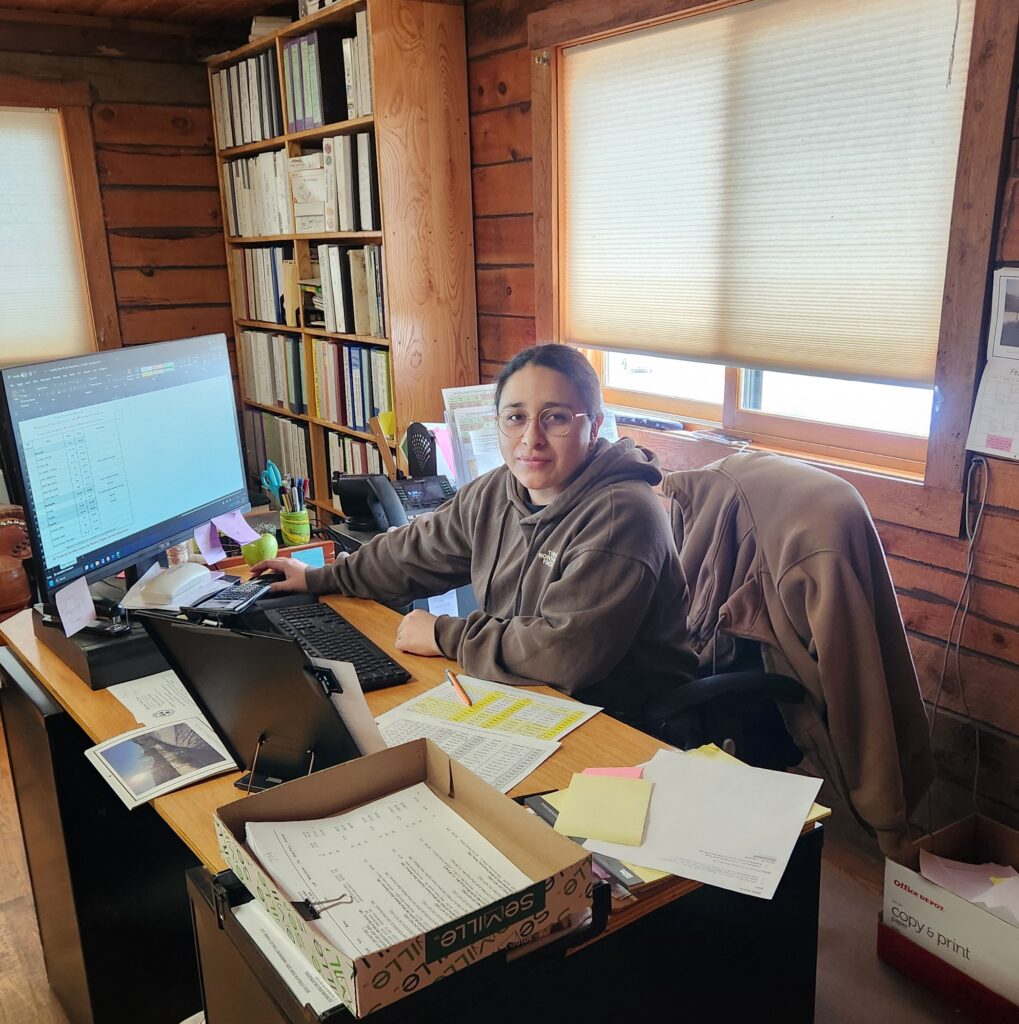 Jimena working at her desk on sales 'stuff' while Sedona is on vacation!