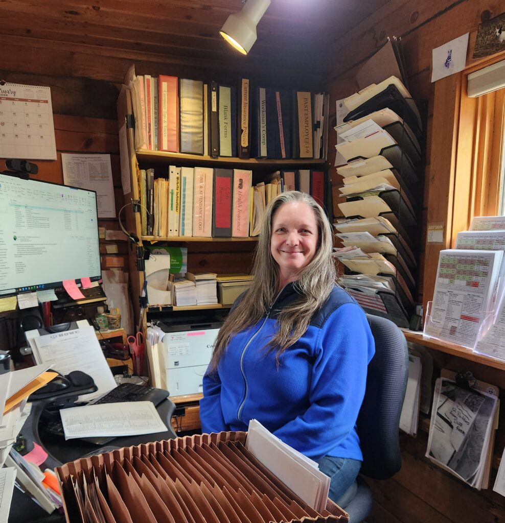 Kelly at her desk working